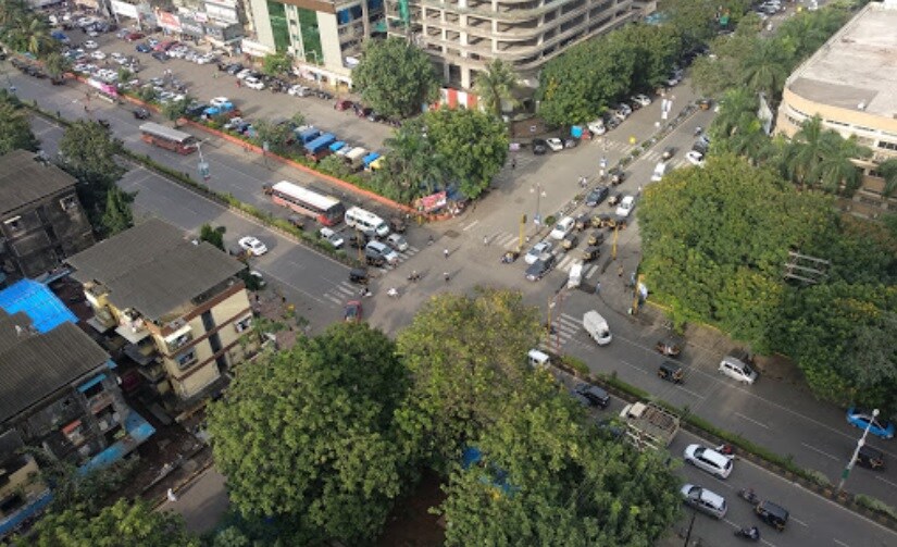 Vashi Sector 1_a city street filled with lots of parked cars